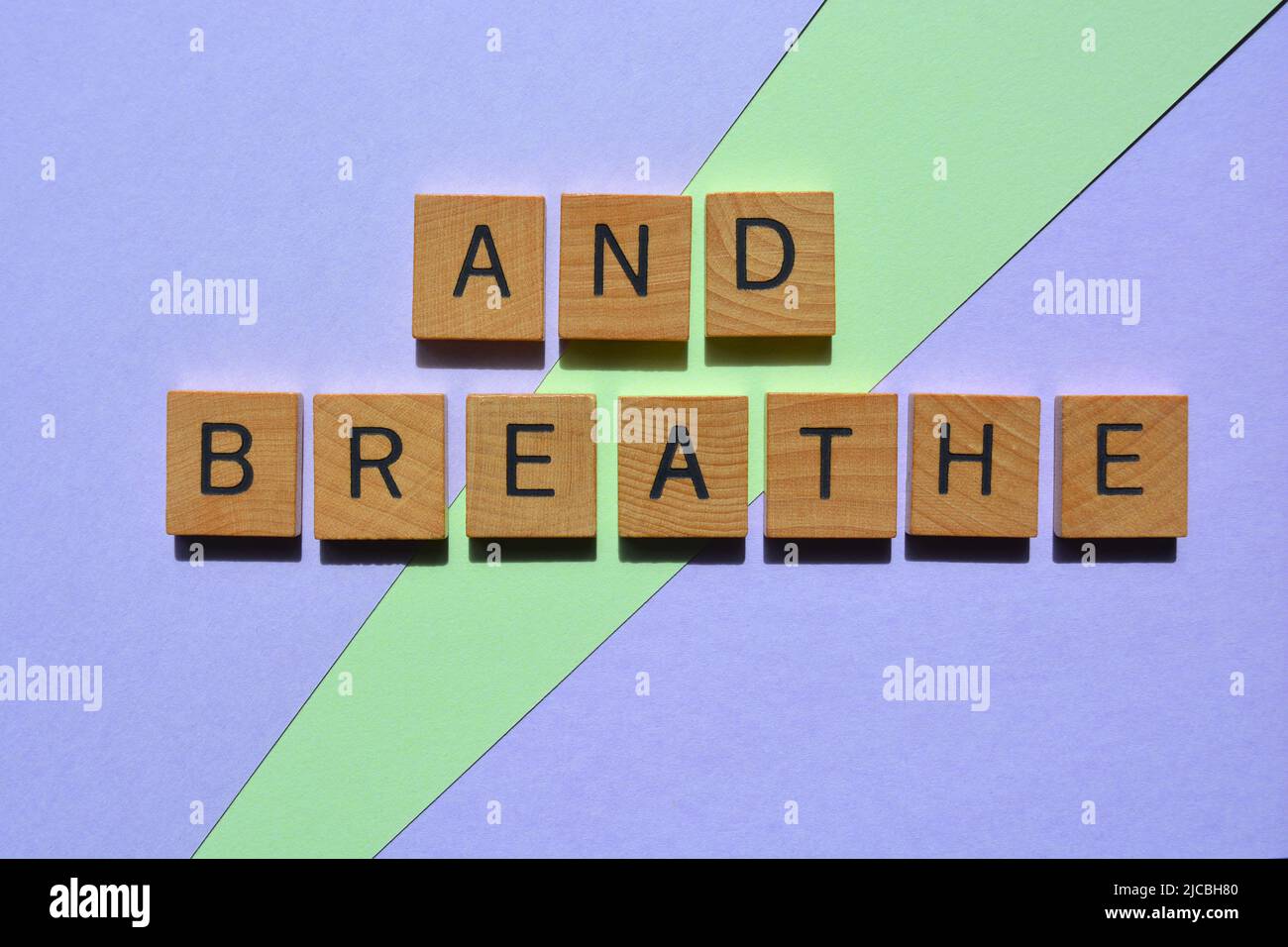 And Breathe, words in wooden alphabet letters isolated on background Stock Photo