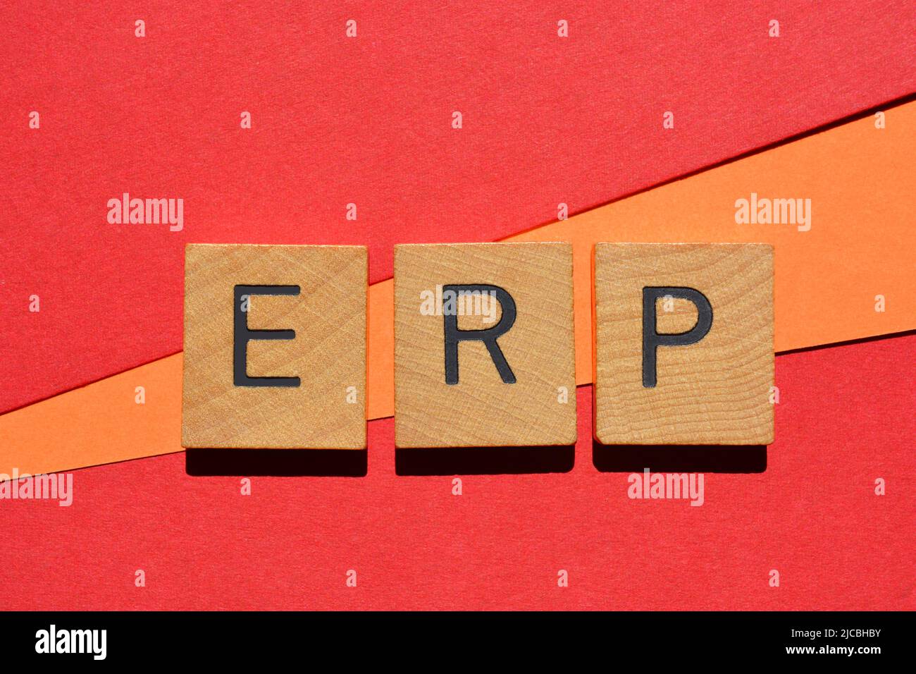 ERP, abbreviation for Enterprise Resource Planning, in wooden alphabet letters isolated on background Stock Photo