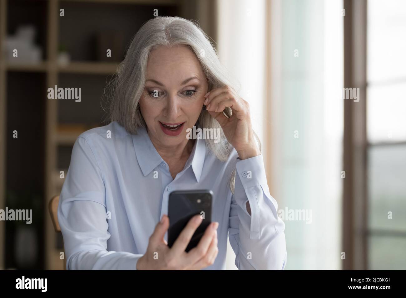Unbelievable! surprised mature woman hi-res stock photography and ...