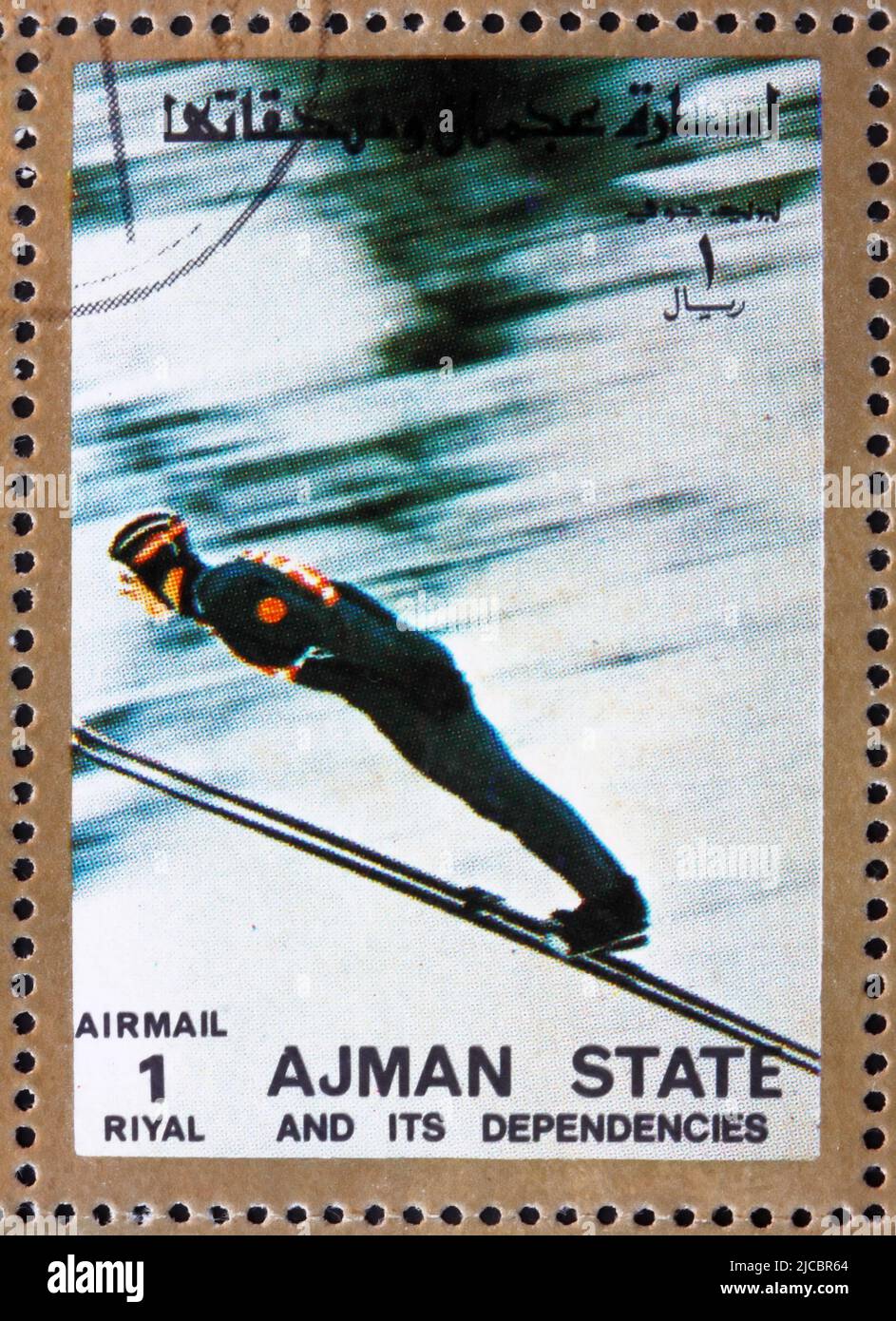 AJMAN - CIRCA 1973: a stamp printed in the Ajman shows Ski Jumping, Winter Olympics, circa 1973 Stock Photo