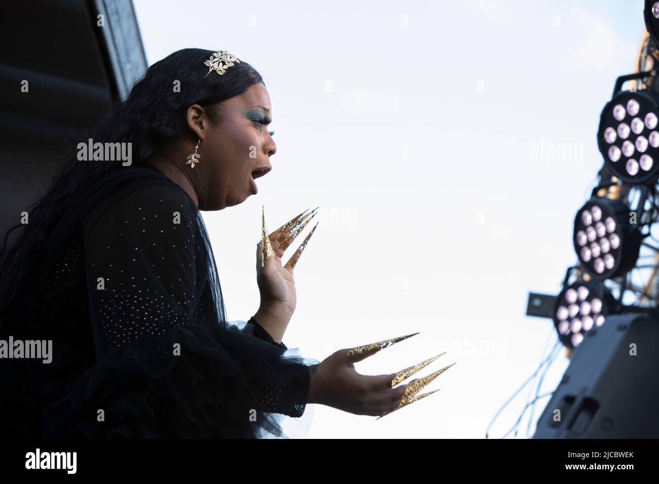 White Center, Washington, USA. 11th June, 2022. A performer entertains the audience with a lyp-synch at the White Center Pride festival. Credit: Paul Christian Gordon/Alamy Live News Stock Photo