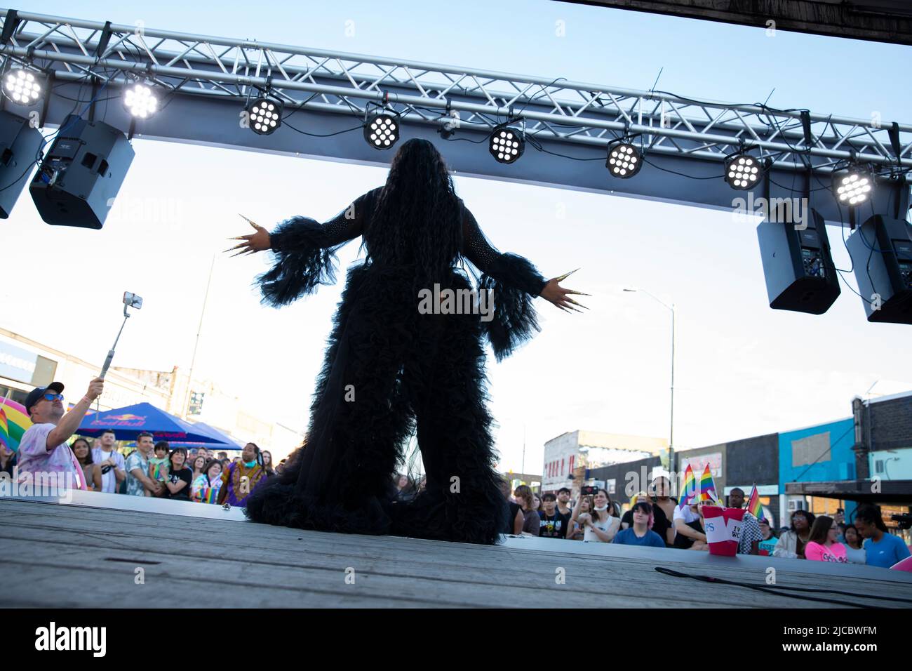 White Center, Washington, USA. 11th June, 2022. A performer entertains the audience with a lyp-synch at the White Center Pride festival. Credit: Paul Christian Gordon/Alamy Live News Stock Photo