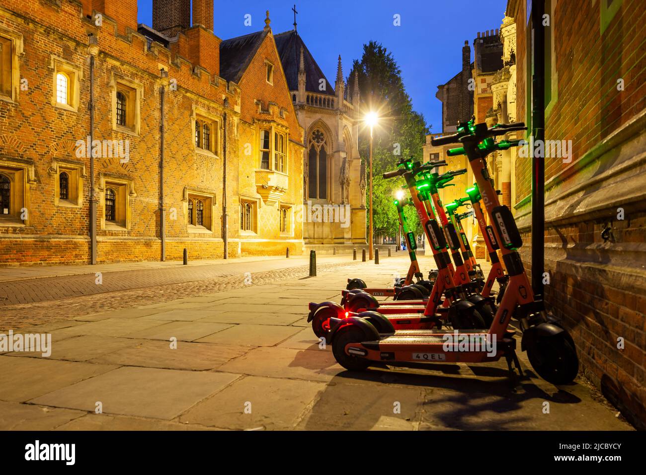 Rental scooters parked on the street in Cambridge city centre, England