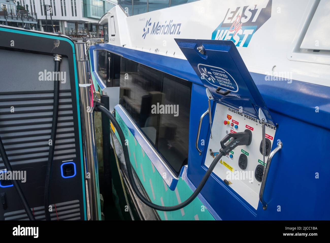 Electric powered ferry boat being charged at wharf, Wellington, North