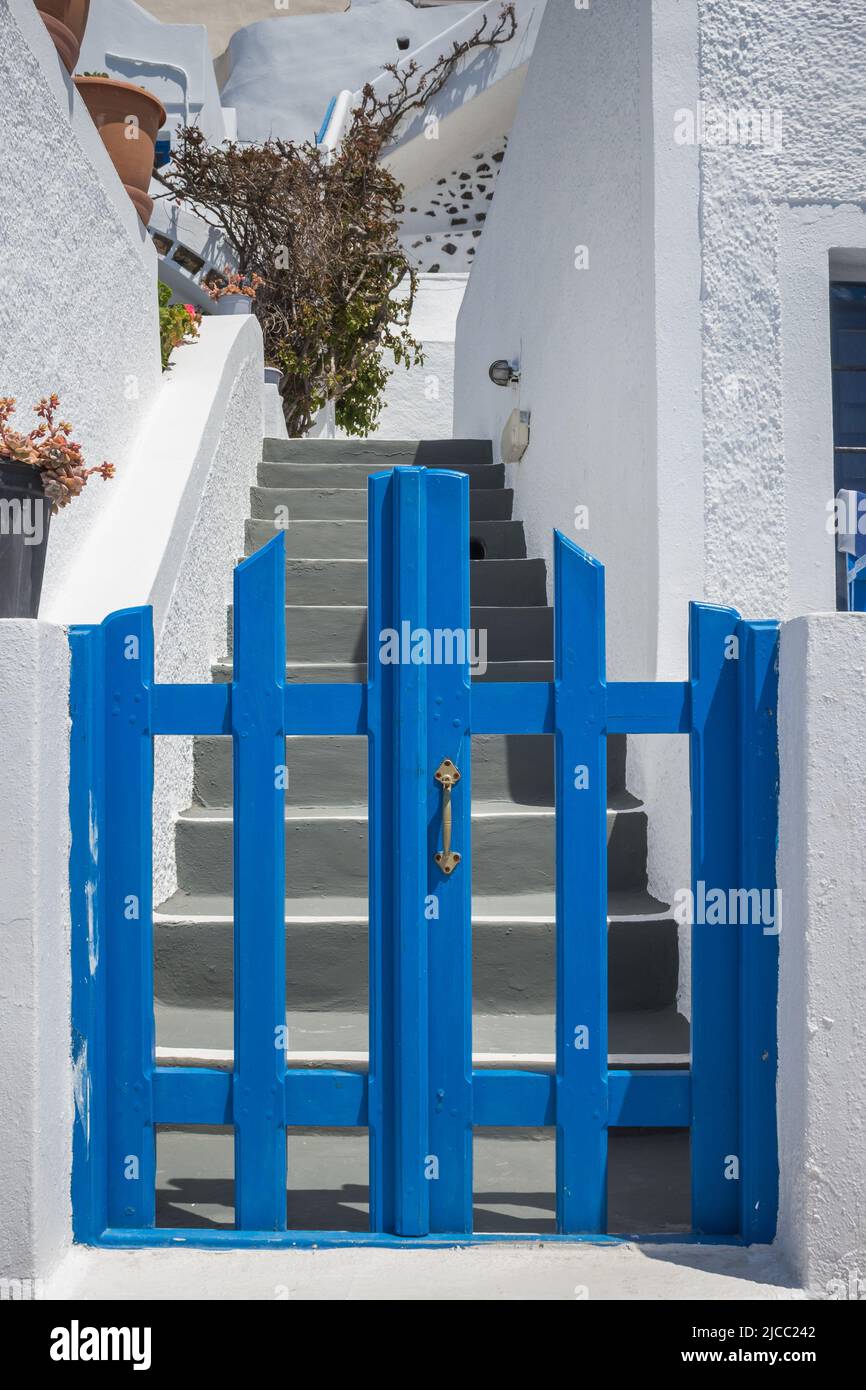 Traditional entrance to a Greek Island home, blue gate and whitewashed