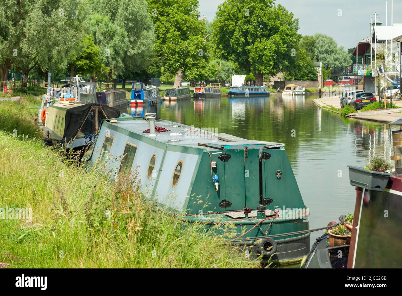 Row of houseboats on river Cam in Cambridge, England. Stock Photo