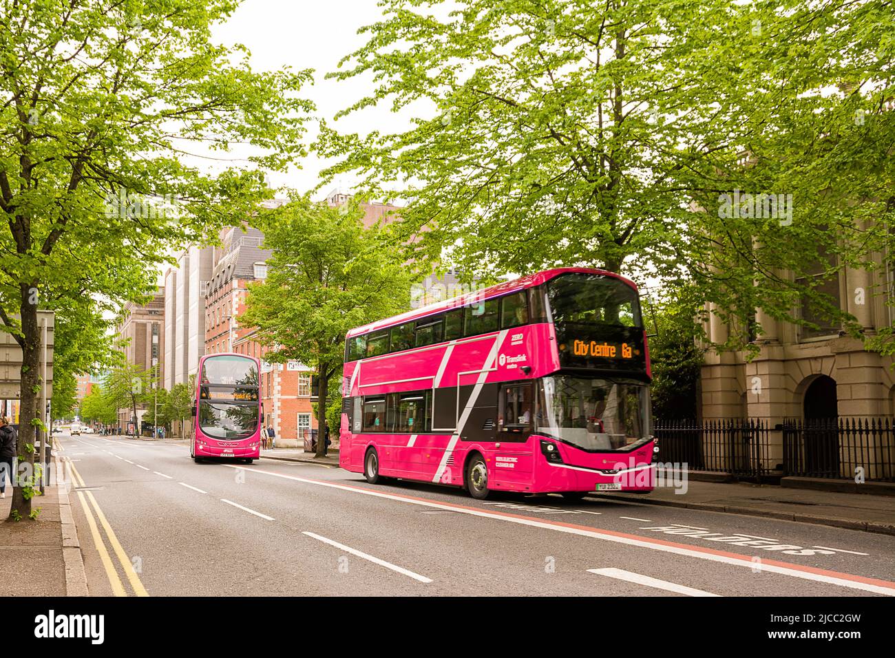 Belfast, United Kingdom - 21 May 2022: Pink bus in Victorian Street in central Belfast Stock Photo