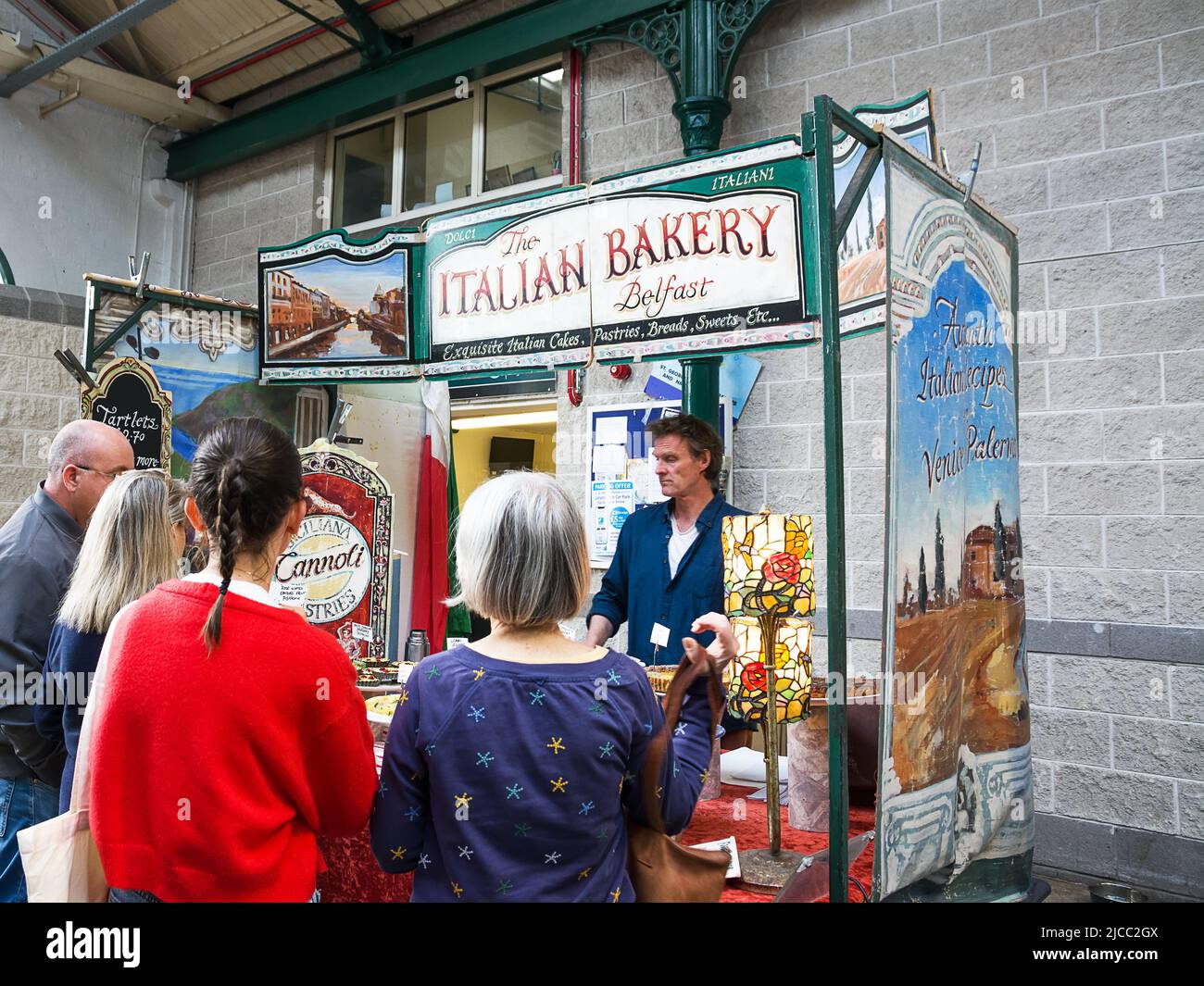 Belfast, United Kingdom - 21 May 2022: Italian food stall and customers looking at it inside St George's Market in Belfast Stock Photo