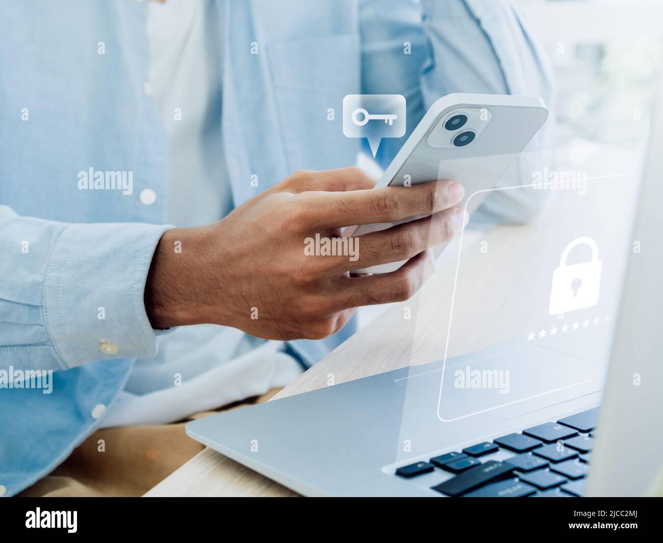 Two factor authentication or 2FA concept. Virtual key icon while access on phone with laptop for validate password, Identity verification, cybersecuri Stock Photo