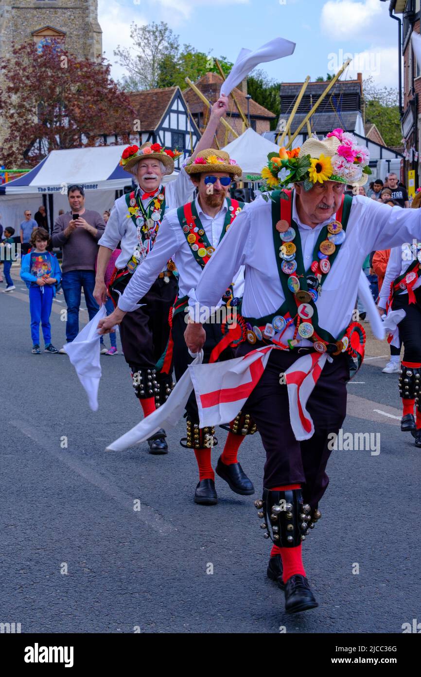 Merrydowners Morris dancers on Pinner High Street at St George’s Day Celebration 2022. Northwest London, England. Stock Photo