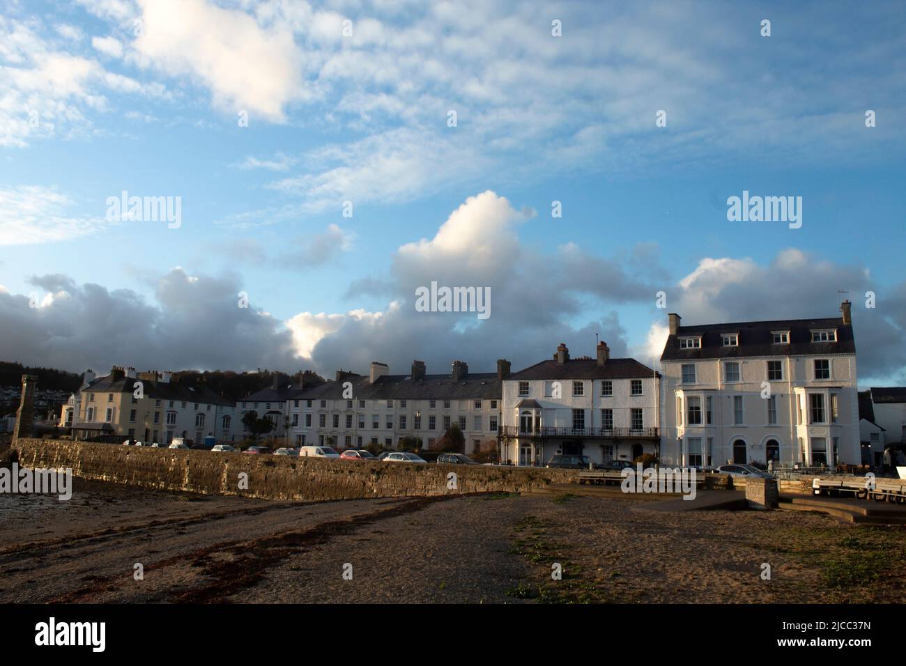 Beaumaris, Anglesey, Wales, beautiful old town. Elegant, historic terrace of houses by the beach on a winter day.  Landscape aspect view with copy spa Stock Photo