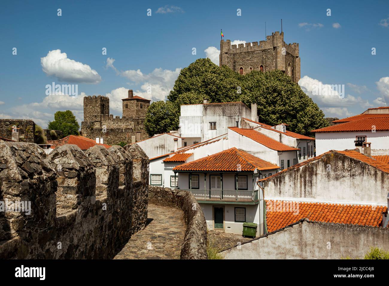 View towards the tower of 'Castelo de Bragança' castle surrounded by white houses with red rooftops, Bragança district, Montesinho, Portugal Stock Photo