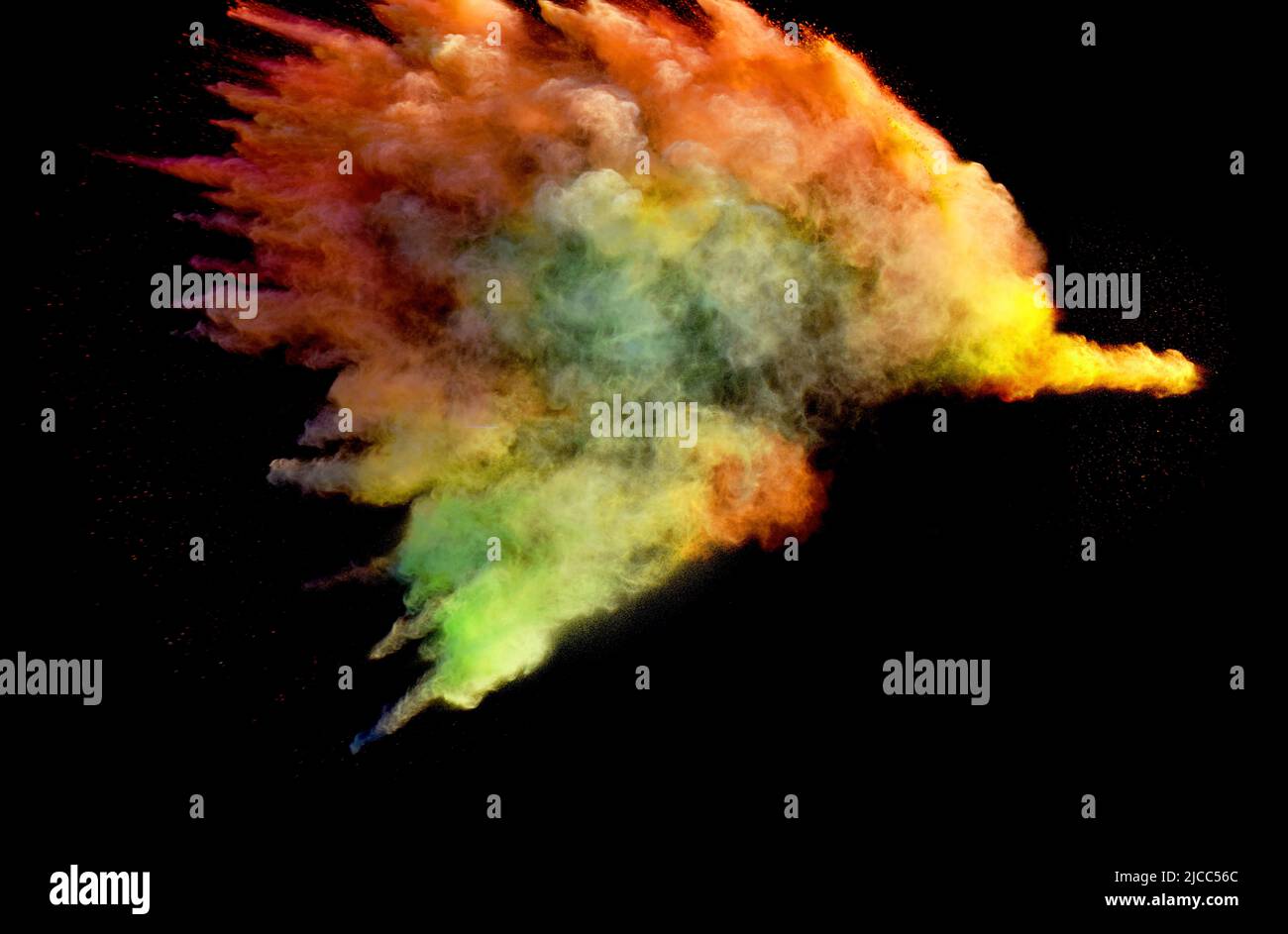 Vivid multicoloured forms of powder paint explode in front of a black