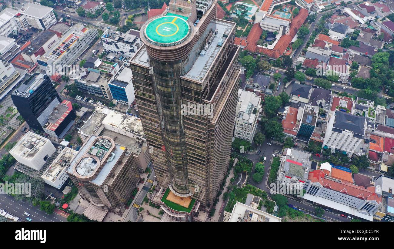 Looking down at twin condos with helipads and other highrises at ...