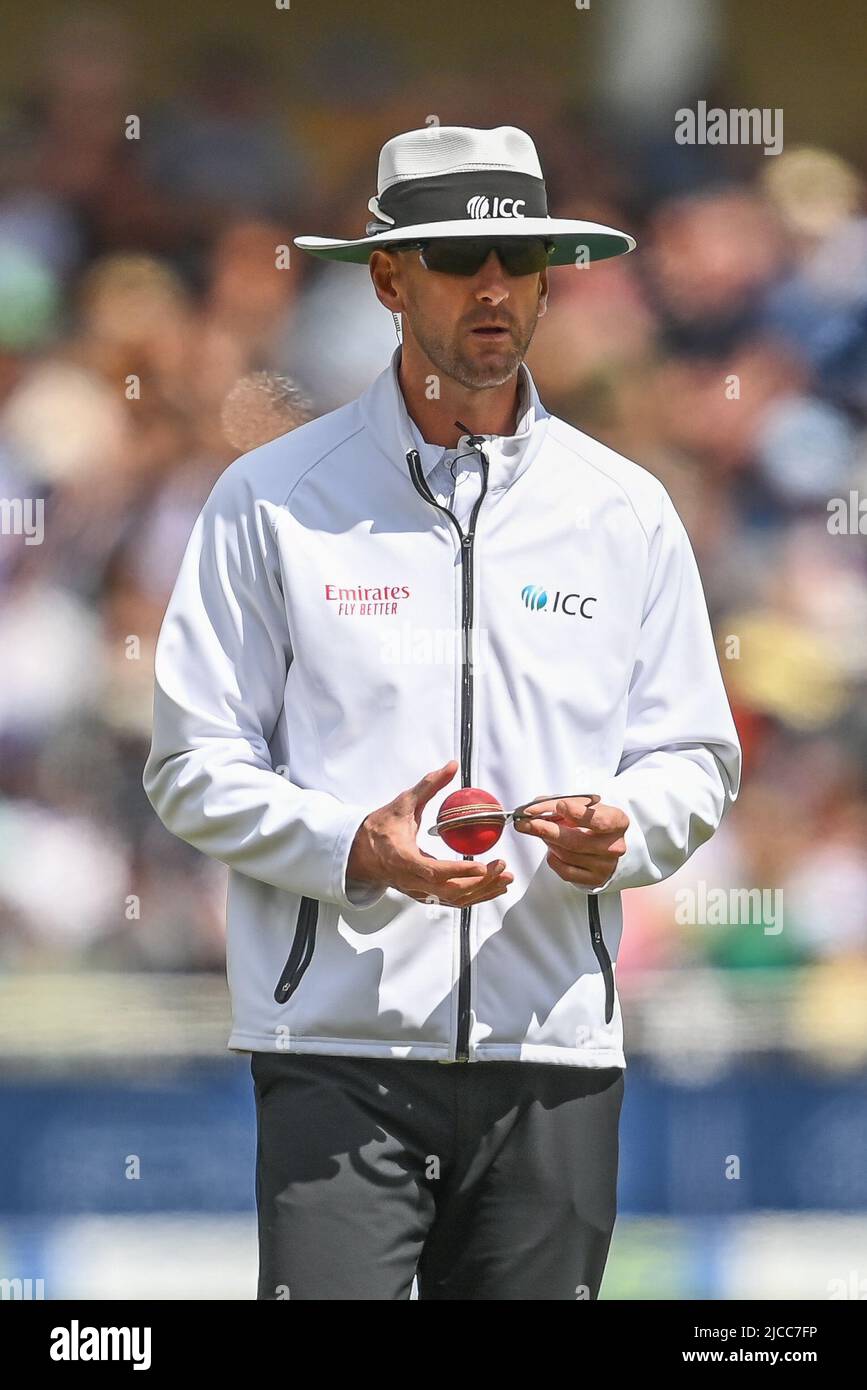 The umpire check the ball in the gauge during the game in , on 6/12