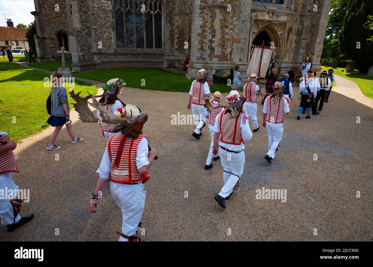 Thaxted, Essex, UK. 12th June 2022.  Sunday Morning 12 June. Morris Dancers process through Thaxted to Thaxted Church-St John the Baptist with our Lady and St Laurence- where a mass was held and a Offertory Dance by Thaxted Morris was danced inside the church. Conrad Noel known as the Red Vicar of Thaxted helped to revive the Thaxted Morris in the 1920's. Credit: BRIAN HARRIS/Alamy Live News Stock Photo