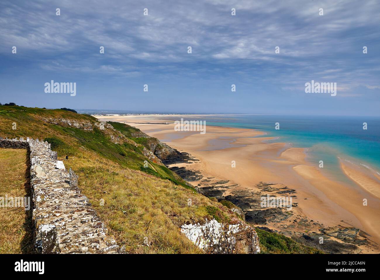 Image of Carteret Plage with the headland in the foreground. Normandy, France Stock Photo