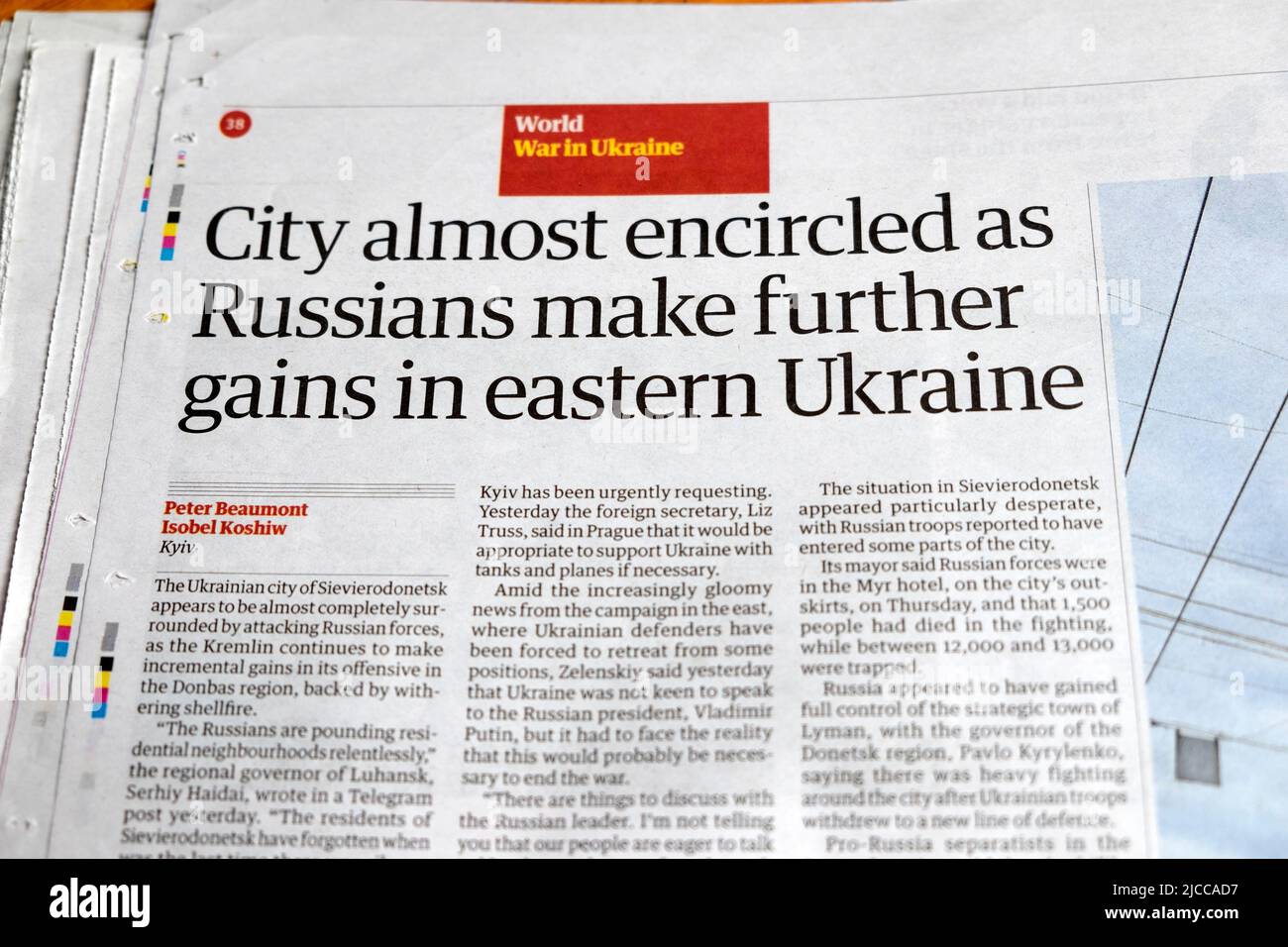 'City almost encircled as Russians make further gains in eastern Ukraine' Guardian newspaper headline Sievierodonetsk clipping 27 May 2022 London UK Stock Photo