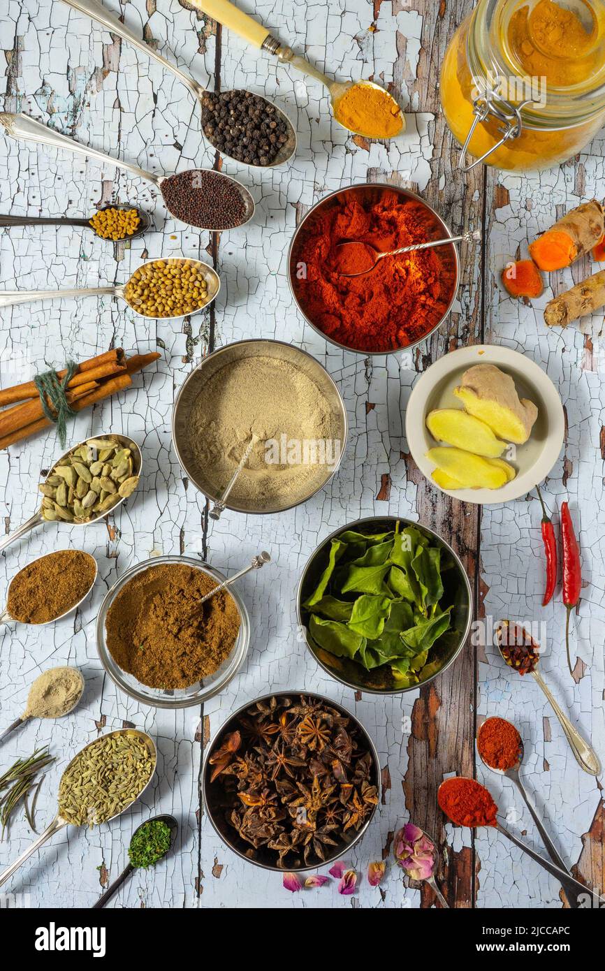 Top view of different spices on a white wooden background Stock Photo