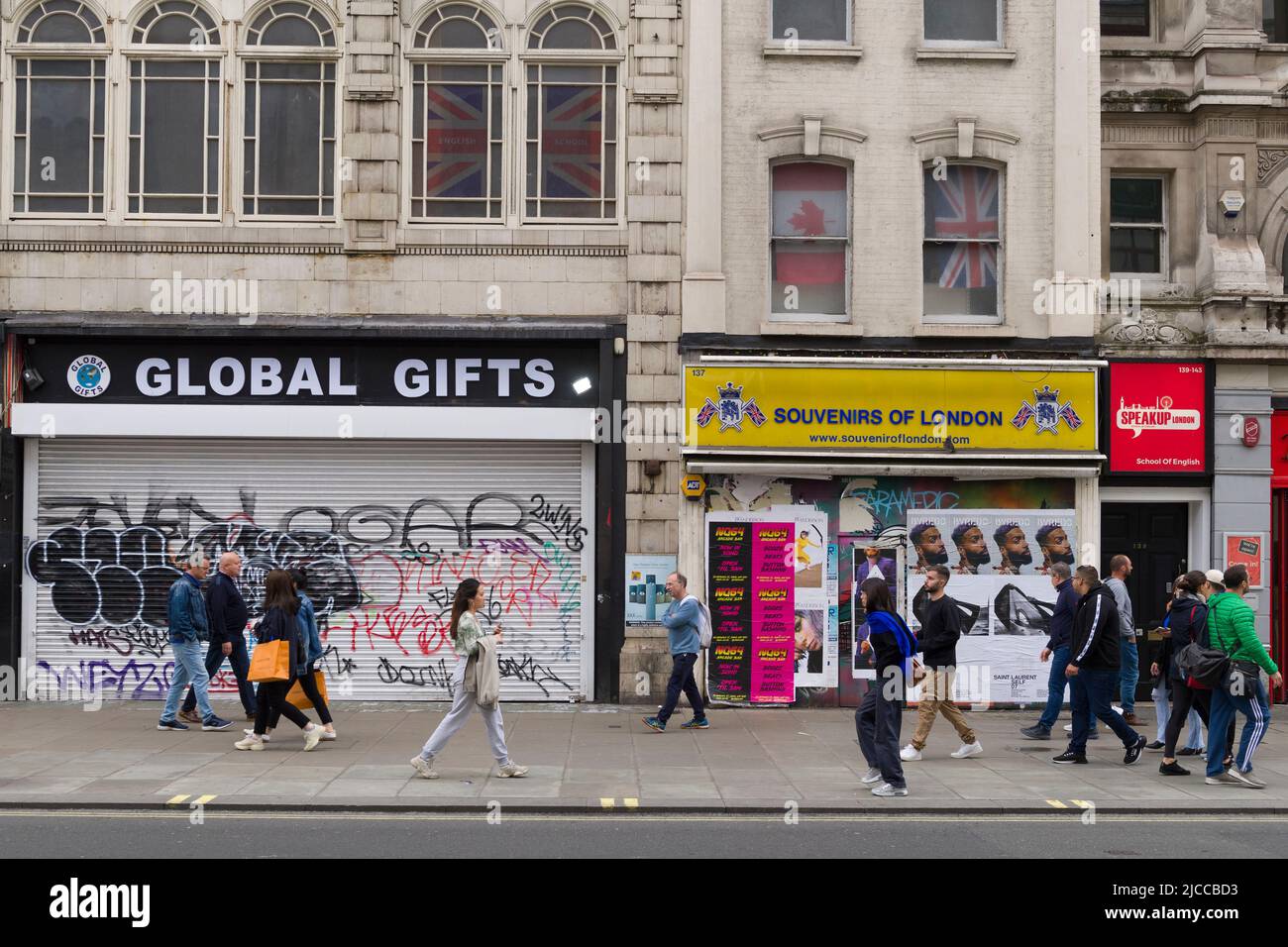 Pedestrians walking past closed down and boarded up shops on Oxford Street, City of Westminster, London, UK.  5 Jun 2022 Stock Photo