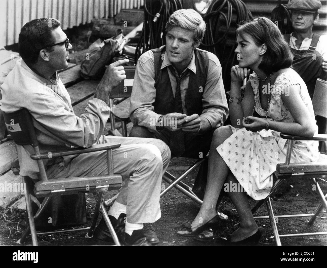 Director SYDNEY POLLACK ROBERT REDFORD NATALIE WOOD and CHARLES BRONSON on set location candid during filming of THIS PROPERTY IS CONDEMNED 1966 director SYDNEY POLLACK play Tennessee Williams screenplay Francis Ford Coppola Fred Coe and Edith Sommer costumes Edith Head Seven Arts Productions / Paramount Pictures Stock Photo