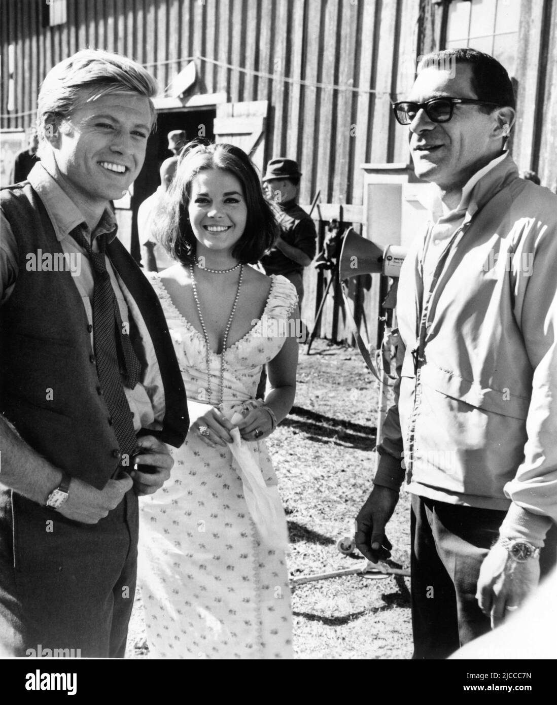 ROBERT REDFORD NATALIE WOOD and Director SYDNEY POLLACK on set location candid during filming of THIS PROPERTY IS CONDEMNED 1966 director SYDNEY POLLACK play Tennessee Williams screenplay Francis Ford Coppola Fred Coe and Edith Sommer costumes Edith Head Seven Arts Productions / Paramount Pictures Stock Photo