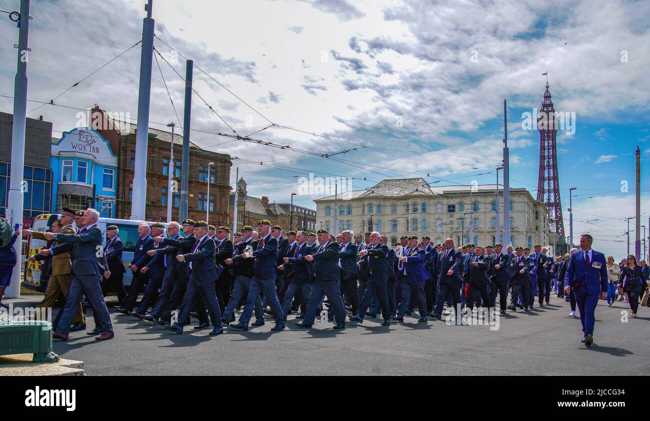 Veterans and members of the 2nd Battalion the Scots Guards, march through the streets of