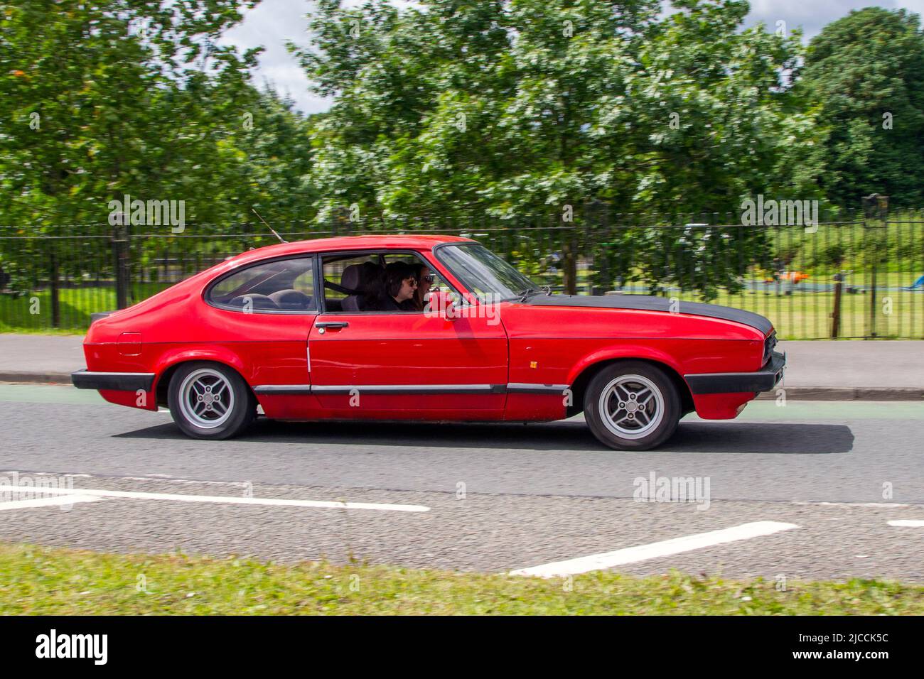 1986 80s eighties red FORD Capri 1993cc petrol 2dr coupe automobiles featured during the 58th year of the Manchester to Blackpool Touring Assembly for Veteran, Vintage, Classic and Cherished cars. Stock Photo