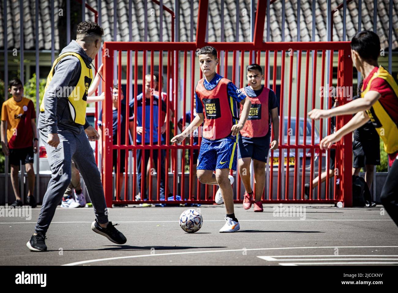 2022-06-12 14:10:14 AMSTERDAM - Football players during the opening of the  football square named after Abdelhak Nouri. Previously, the square bore the  name of former Ajax player Nigel de Jong, but it