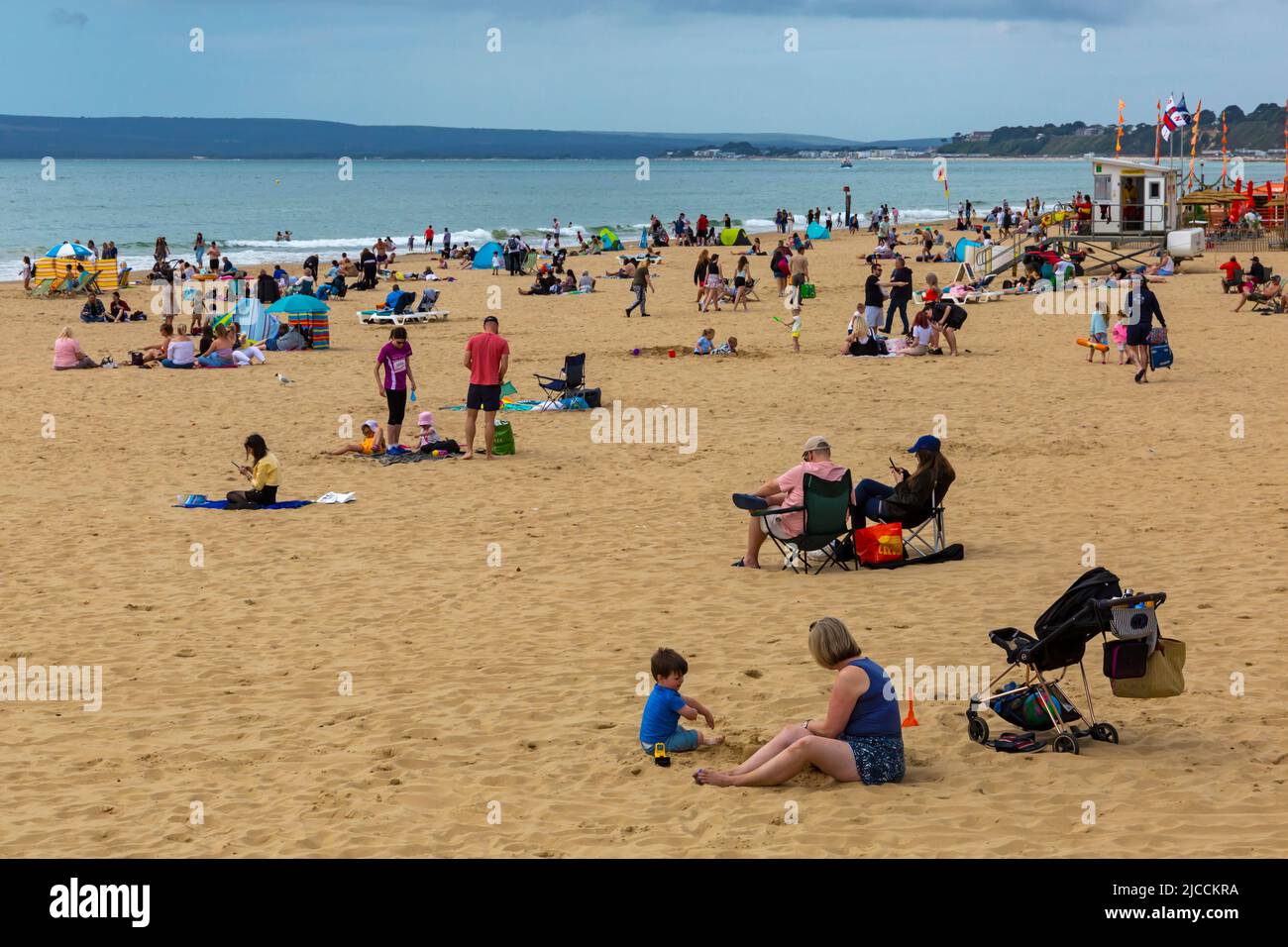 Bournemouth, Dorset UK. 12th June 2022. UK weather: sunny intervals and breezy at Bournemouth beaches as sunseekers head to the seaside. Credit: Carolyn Jenkins/Alamy Live News Stock Photo