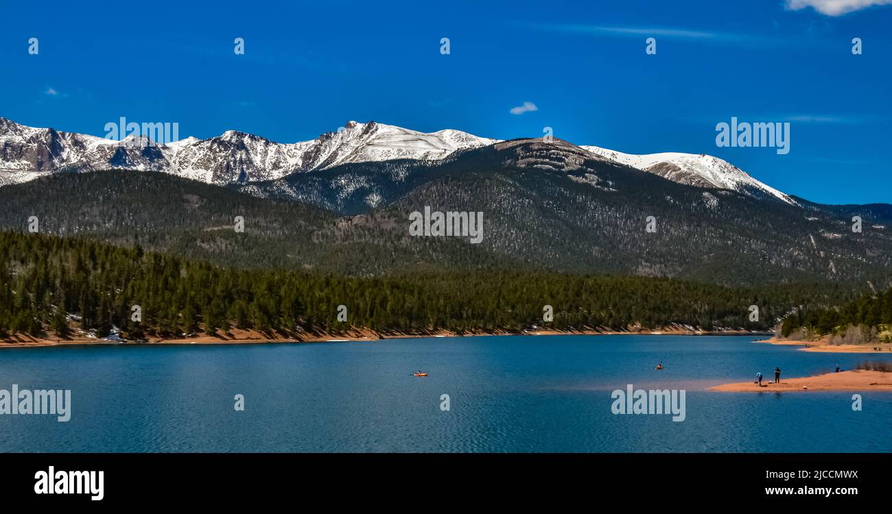 Pikes Peak panorama. Snow-capped and forested mountains near a mountain