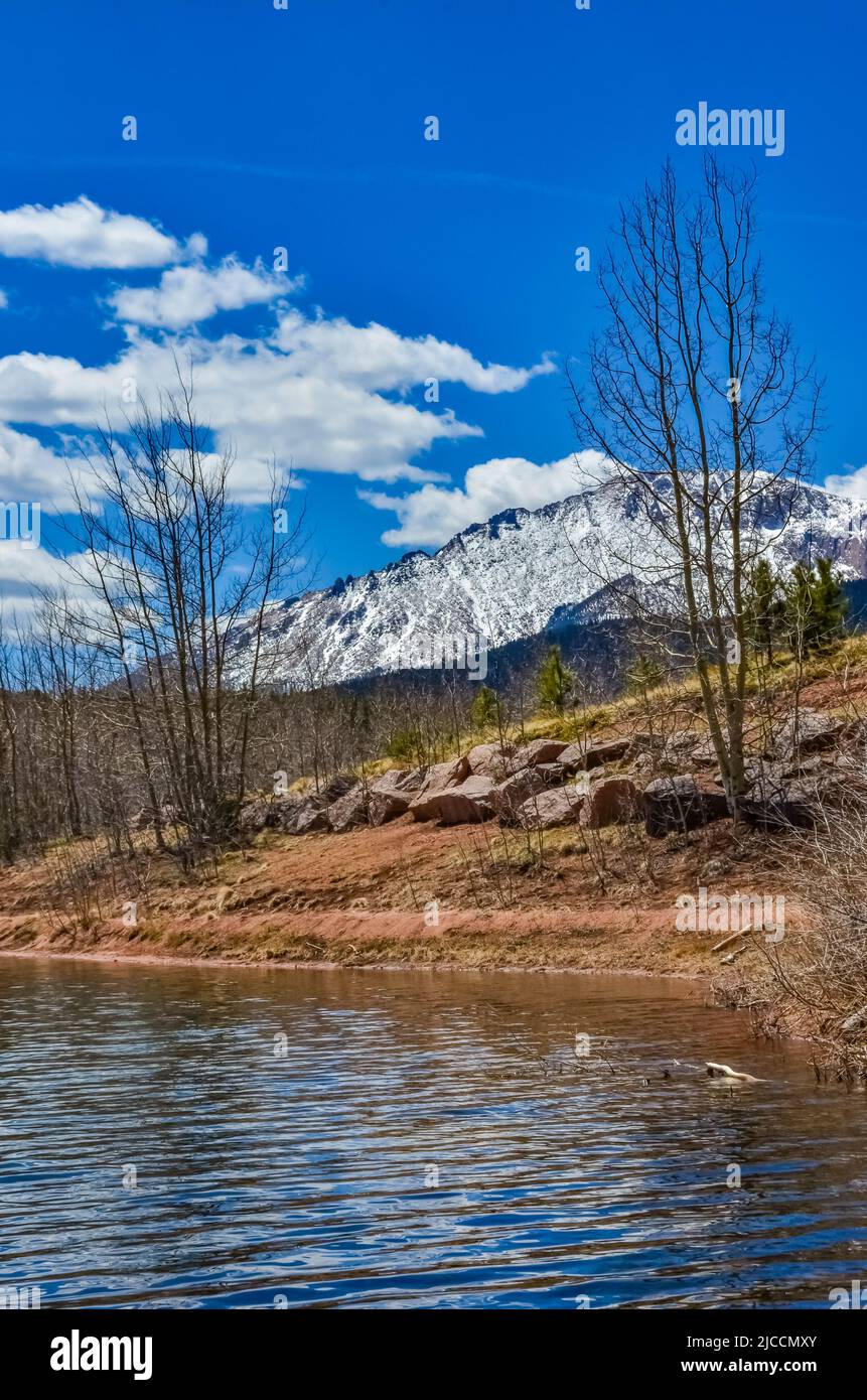 Crystal Creek reservoir near snow-capped mountains Pikes Peak Mountains ...