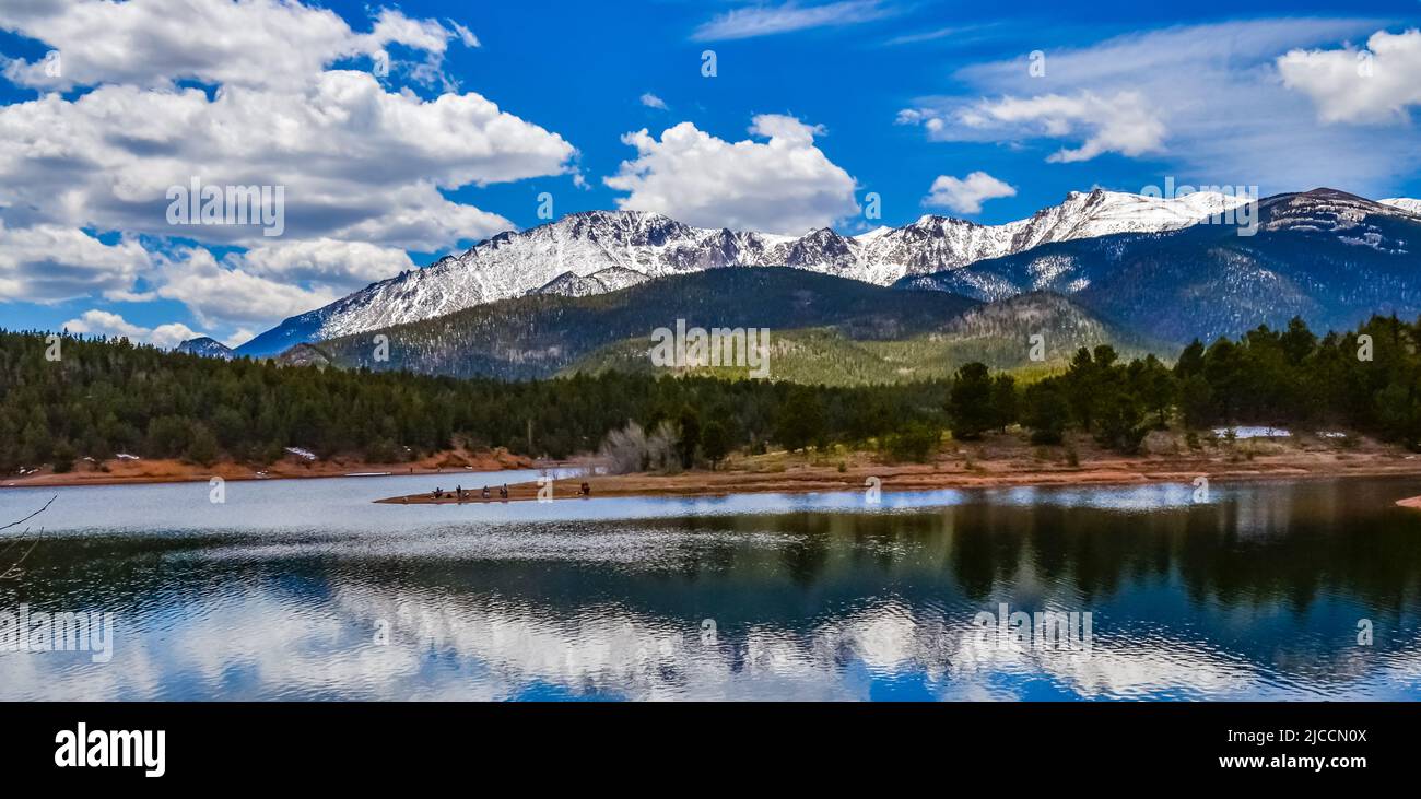 Pikes Peak panorama. Snowcapped and forested mountains near a mountain