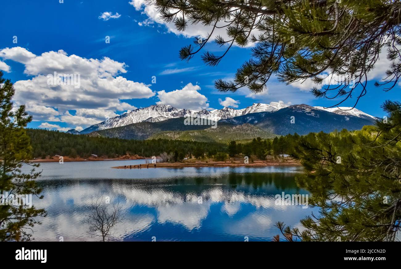 Pikes Peak panorama. Snow-capped and forested mountains near a mountain