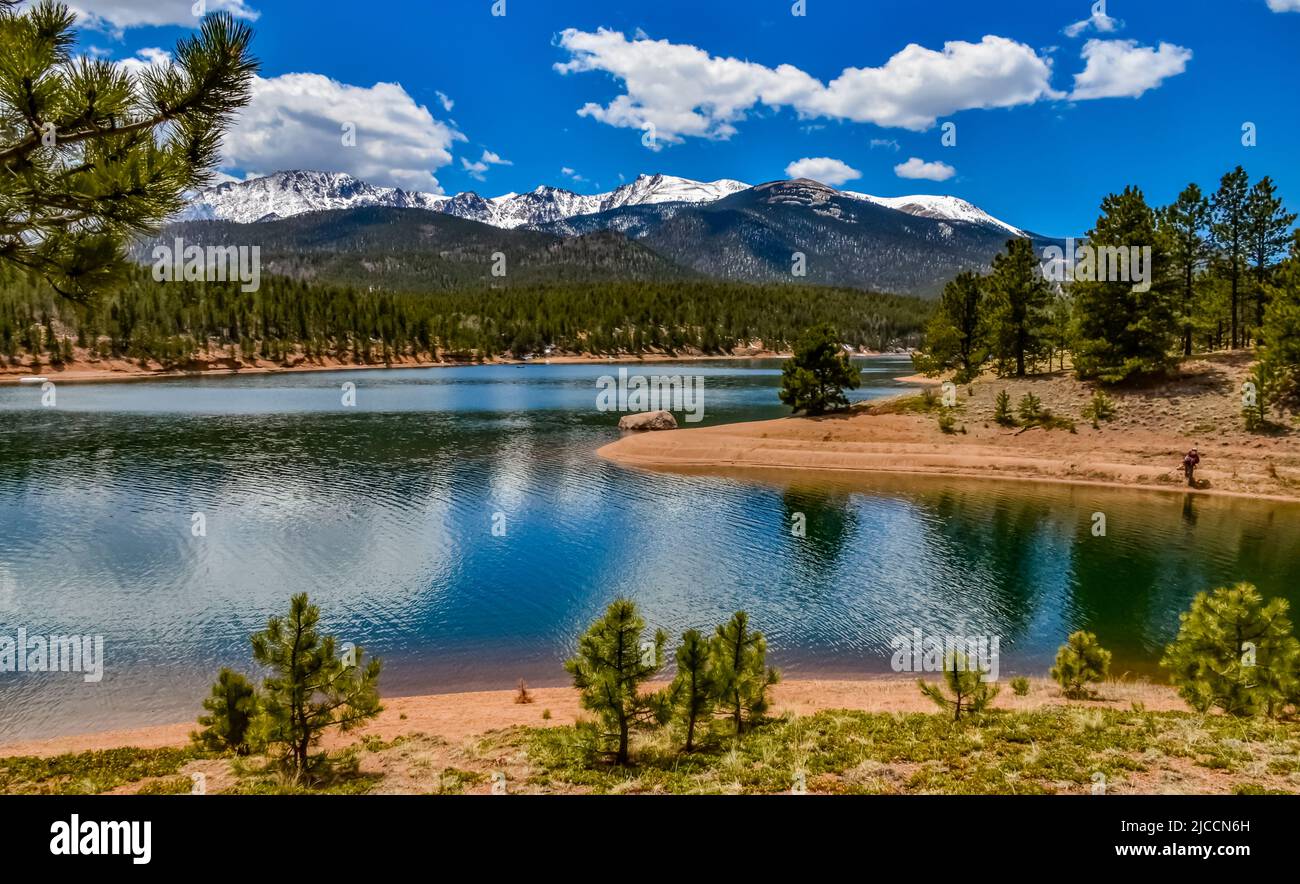 Pikes Peak panorama. Snowcapped and forested mountains near a mountain