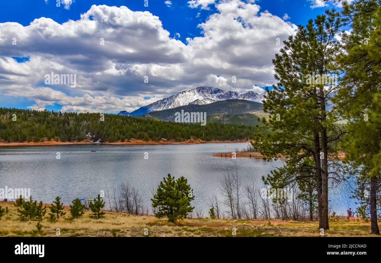 Pikes Peak panorama. Snowcapped and forested mountains near a mountain