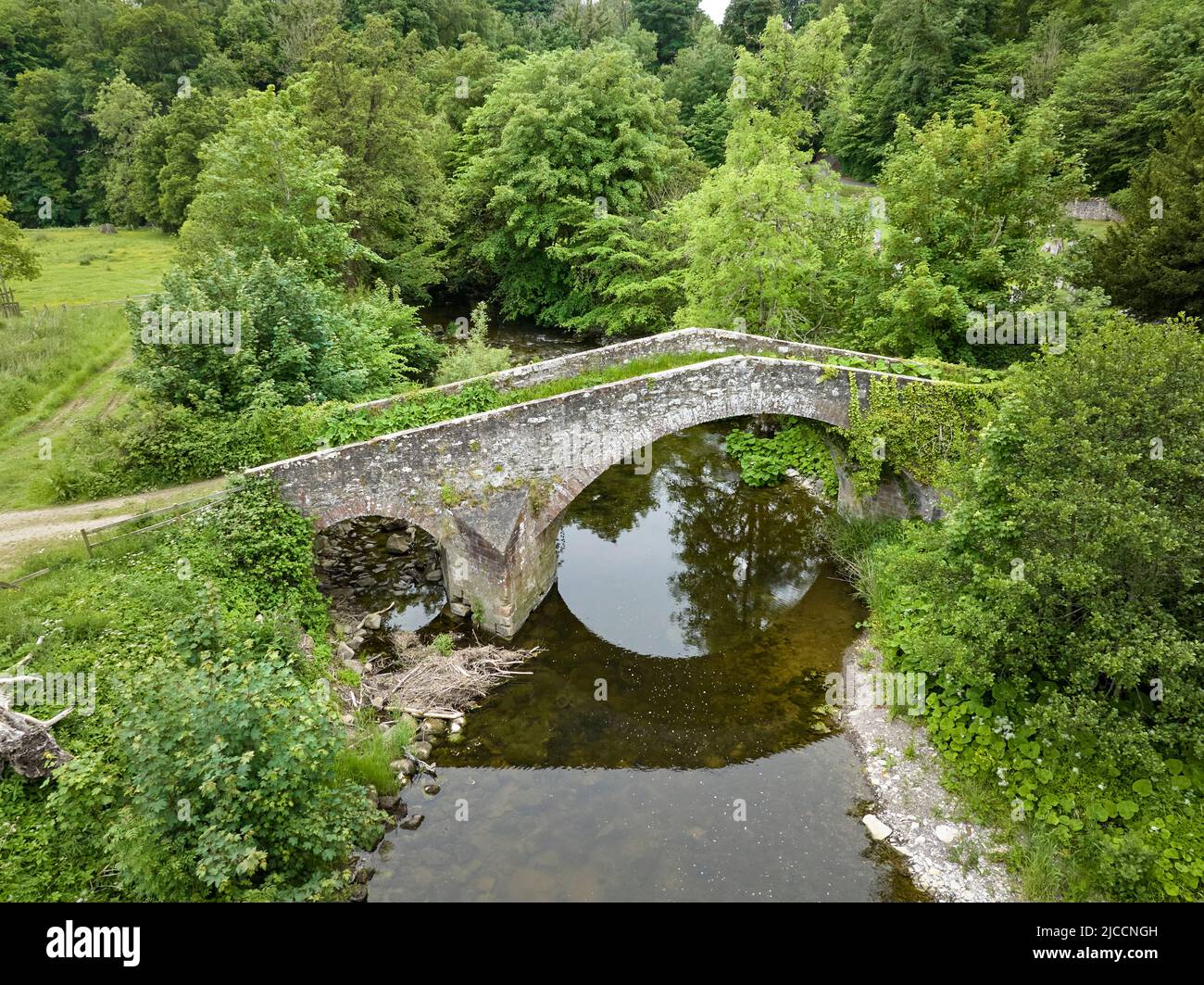 Aerial shot of  the Bridge Over the Ale Water At Ancrum Old Parish Church, Ancrum. Stock Photo