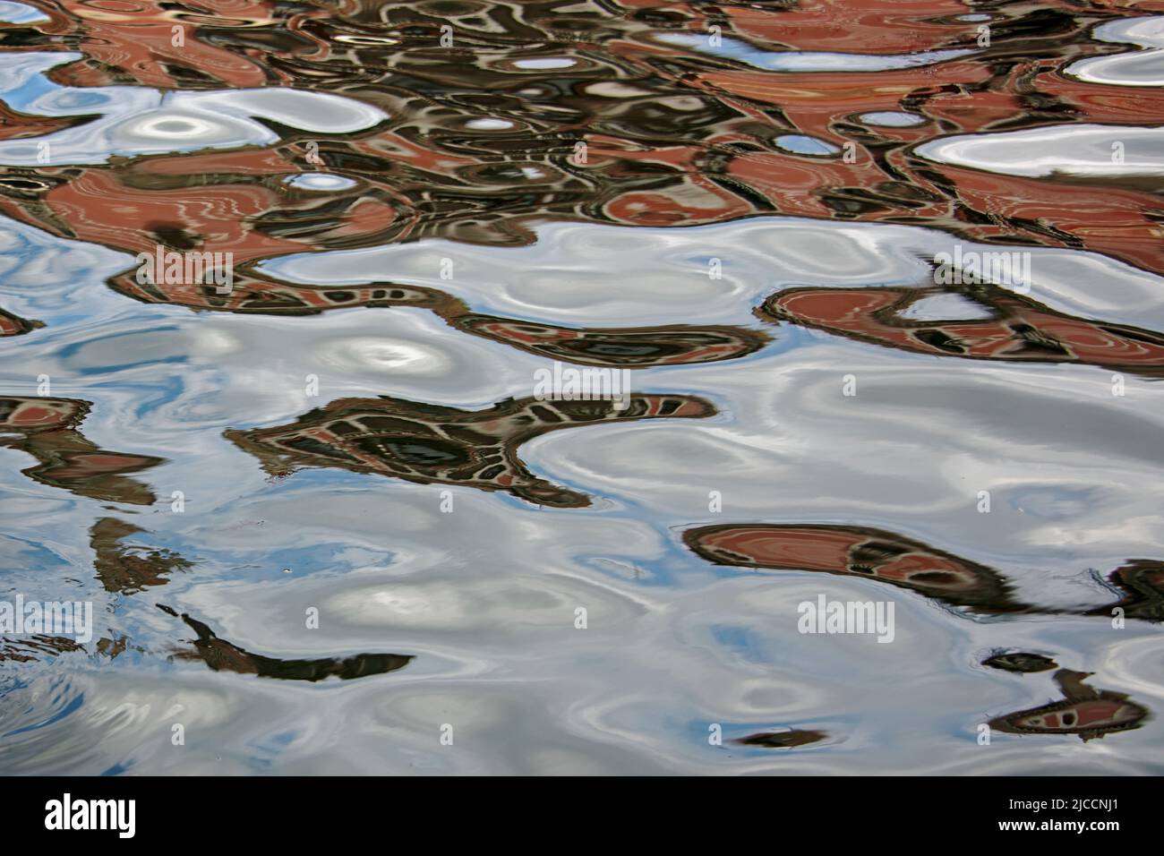 Abstract art because of the mirroring in various colors on the water Stock Photo