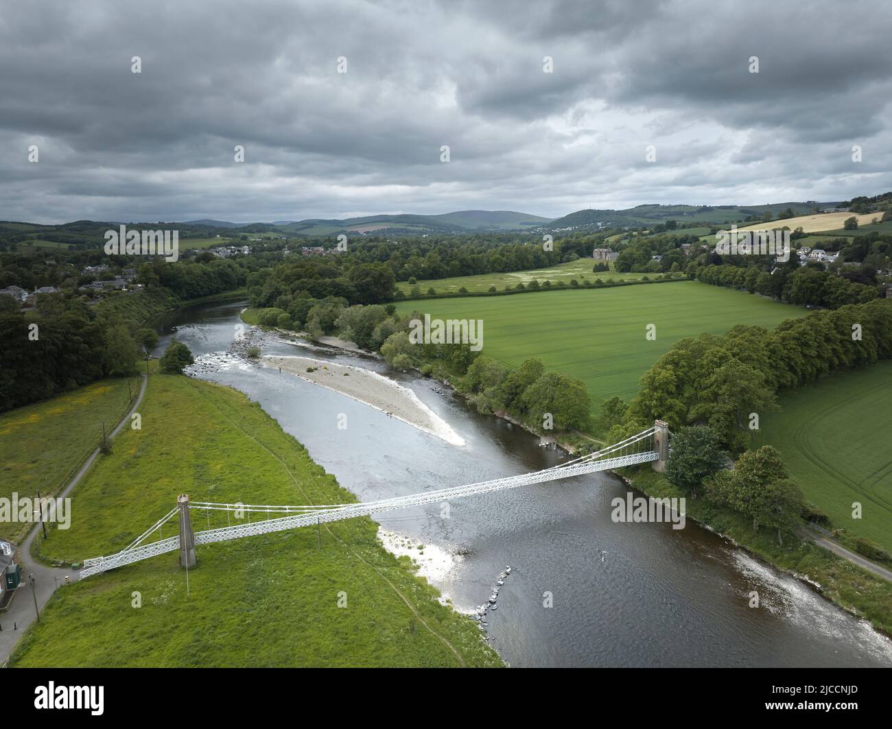 Aerial view of Gattonside Suspension Footbridge over the River Tweed at Melrose in the Scottish Borders.Looking upstream towards Melrose. Stock Photo