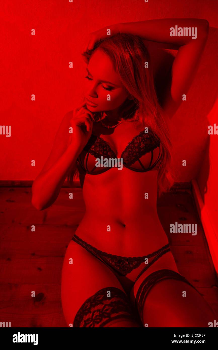 Sexy sensual blonde woman in red underwear sit in corner with closed eyes in red light, desire Stock Photo - Alamy Sexy sensual blonde woman in red underwear sit in corner with closed eyes in red light, desire Stock Photo - Alamy