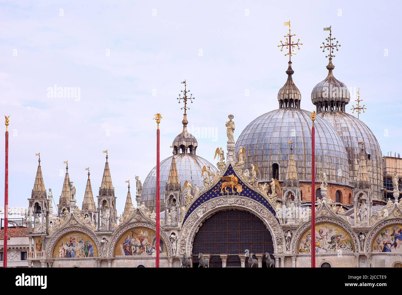 Close-up of St Mark Cathedral with dome and art work decorations. International landmark in Venice, Italy. Stock Photo