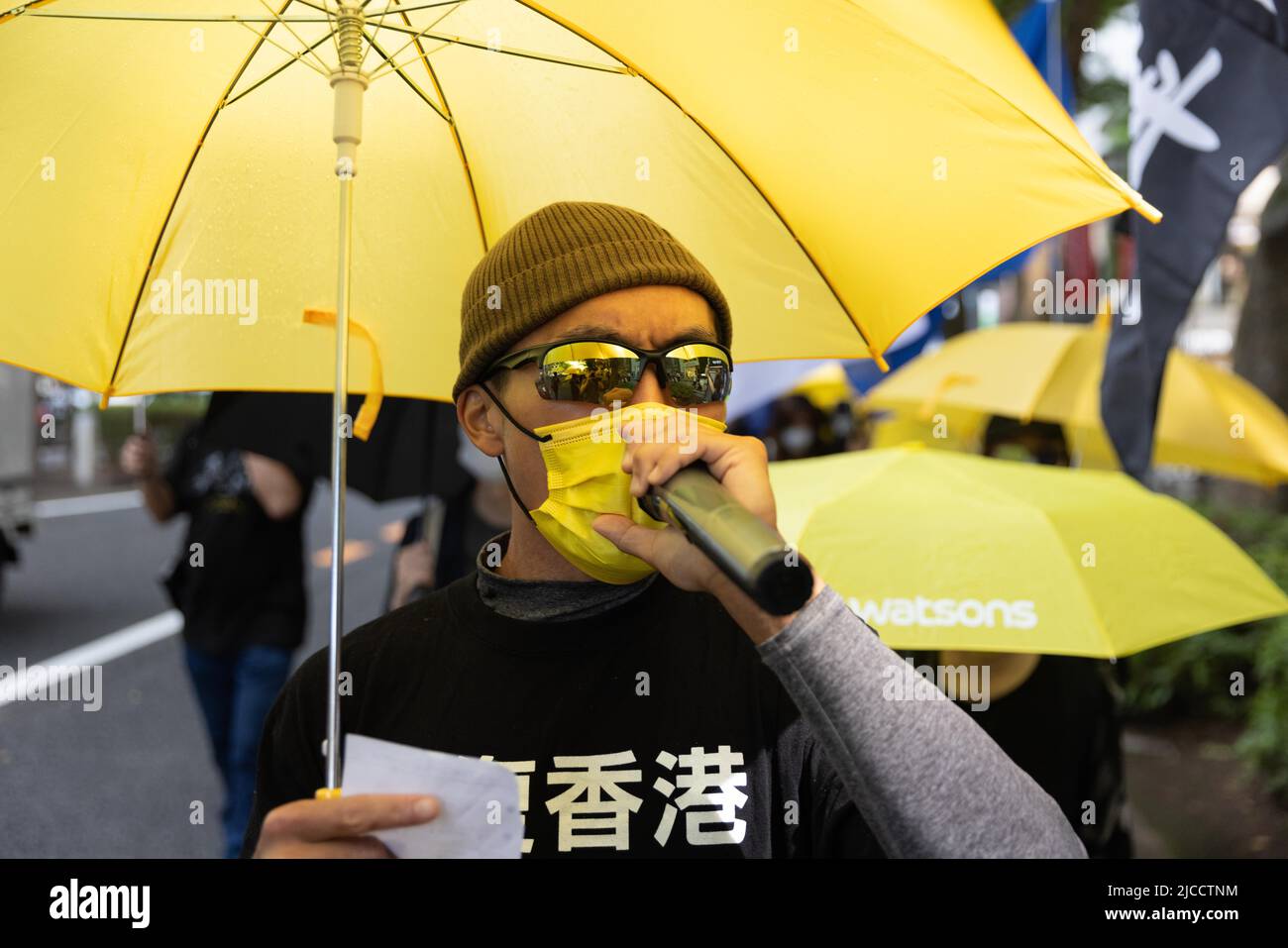 Tokyo, Japan. 12th June, 2022. Demonstrator chants pro-democracy slogans while walking through the streets in Omote-Sando during the three year anniversary of the June 12, 2019 Hong Kong protest. June 12, 2022 marks the three year anniversary of the June 12, 2019 Hong Kong protest. It was sparked by the controversial Fugitive Offenders amendment bill also known as extradition bill. Several thousands of citizens of Hong Kong demonstrated against the bill and it was the beginning of the Hong Kong protests (2019-2020). Credit: SOPA Images Limited/Alamy Live News Stock Photo