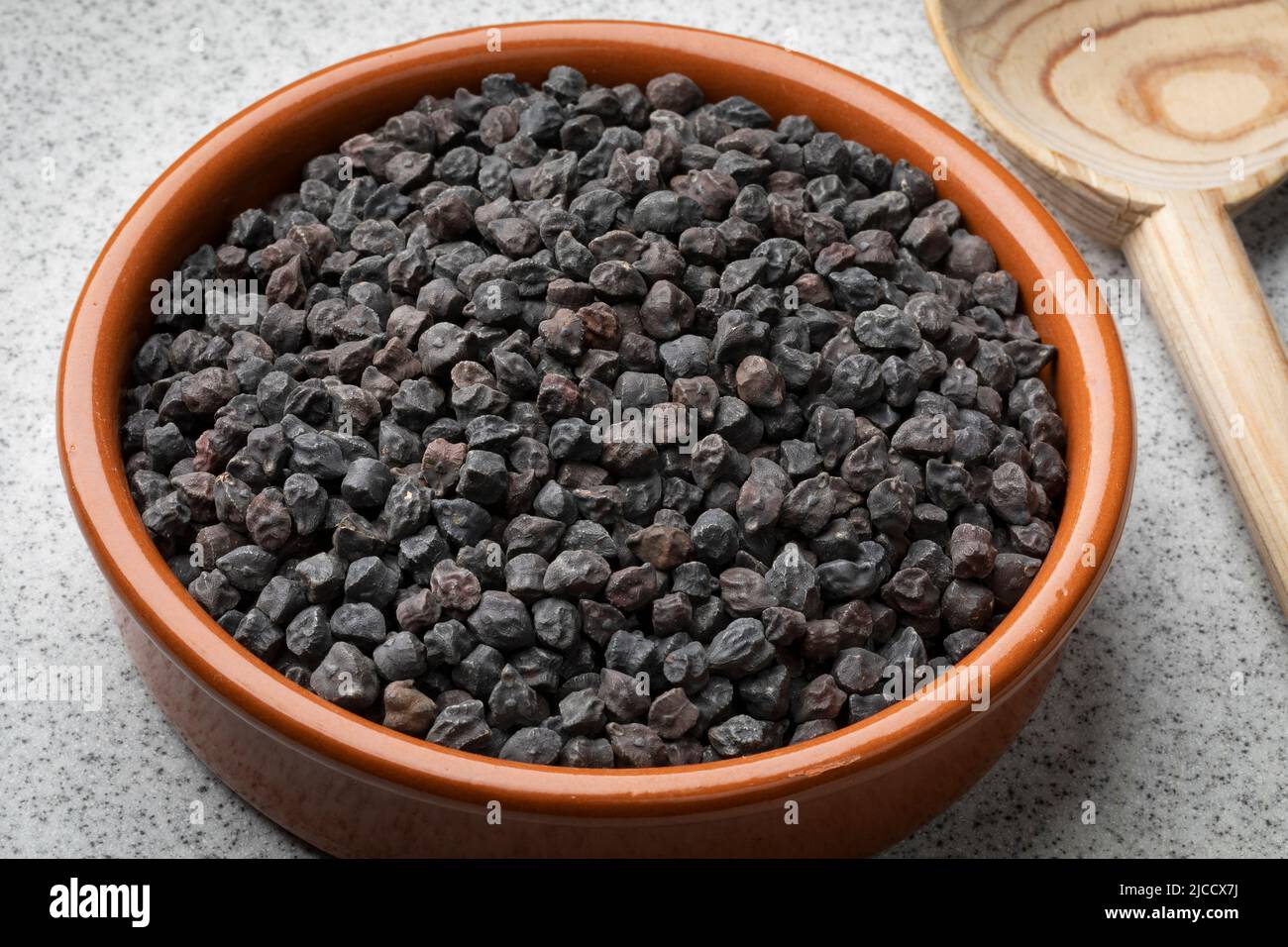 Bowl with black chickpea Murgia, ceci nero, also known by the name of cece del solco dritto in Italy Stock Photo