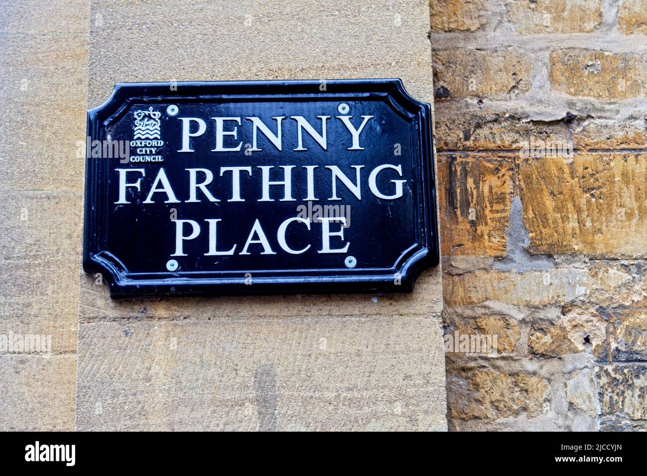 A sign on a wall in Oxford for Penny Farthing Place Stock Photo