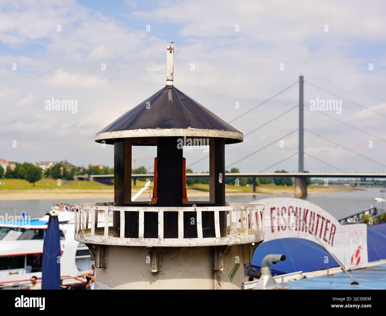 Decorational lighthouse at a fish restaurant at the Rhine river promenade in Düsseldorf/Germany. Stock Photo