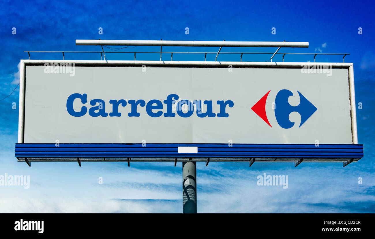 POZNAN, POL - MAY 1, 2022: Advertisement billboard displaying logo of Carrefour, a French multinational corporation specialized in retail Stock Photo