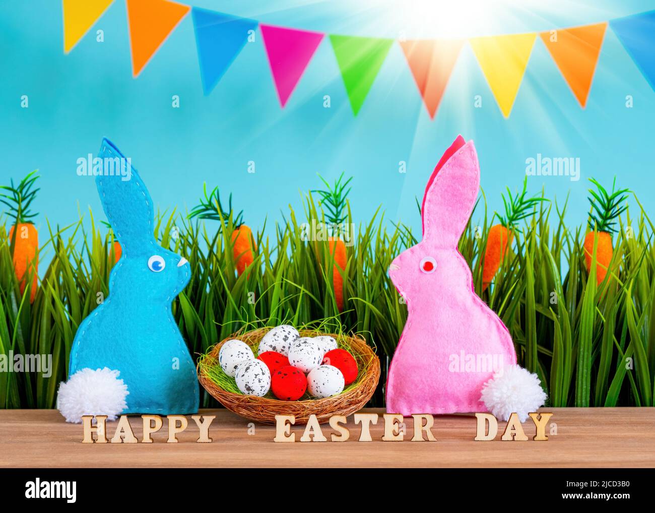 Easter background with eggs, rabbits and green grass Stock Photo