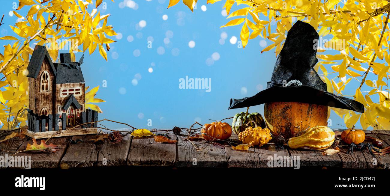 Halloween background with pumpkins, candles and autumn leaves Stock Photo