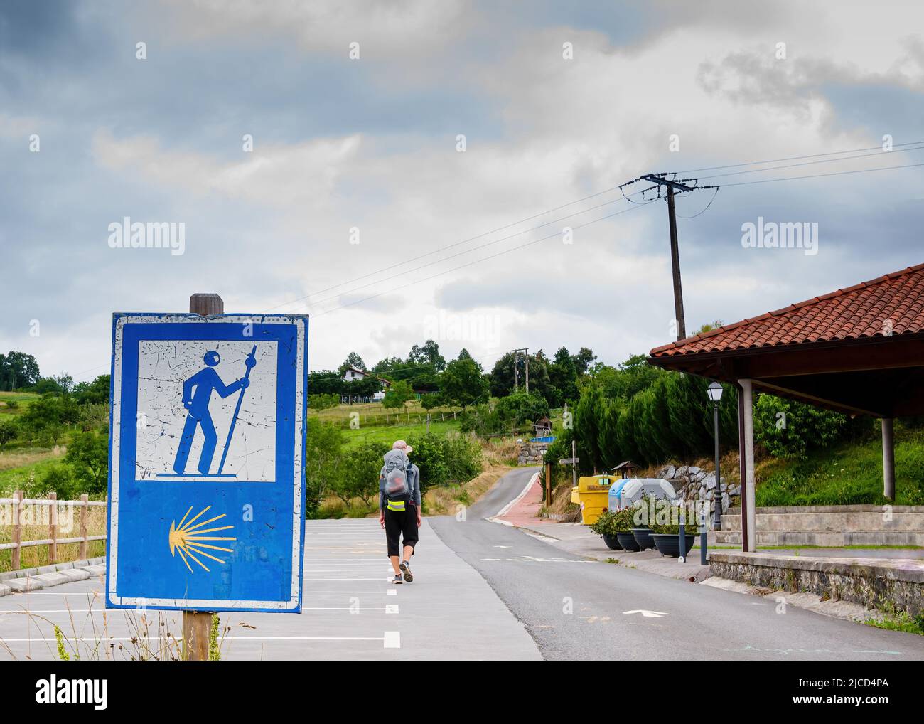 Lonely Pilgrim with backpack walking the Camino de Santiago in Spain, Way of St James Stock Photo