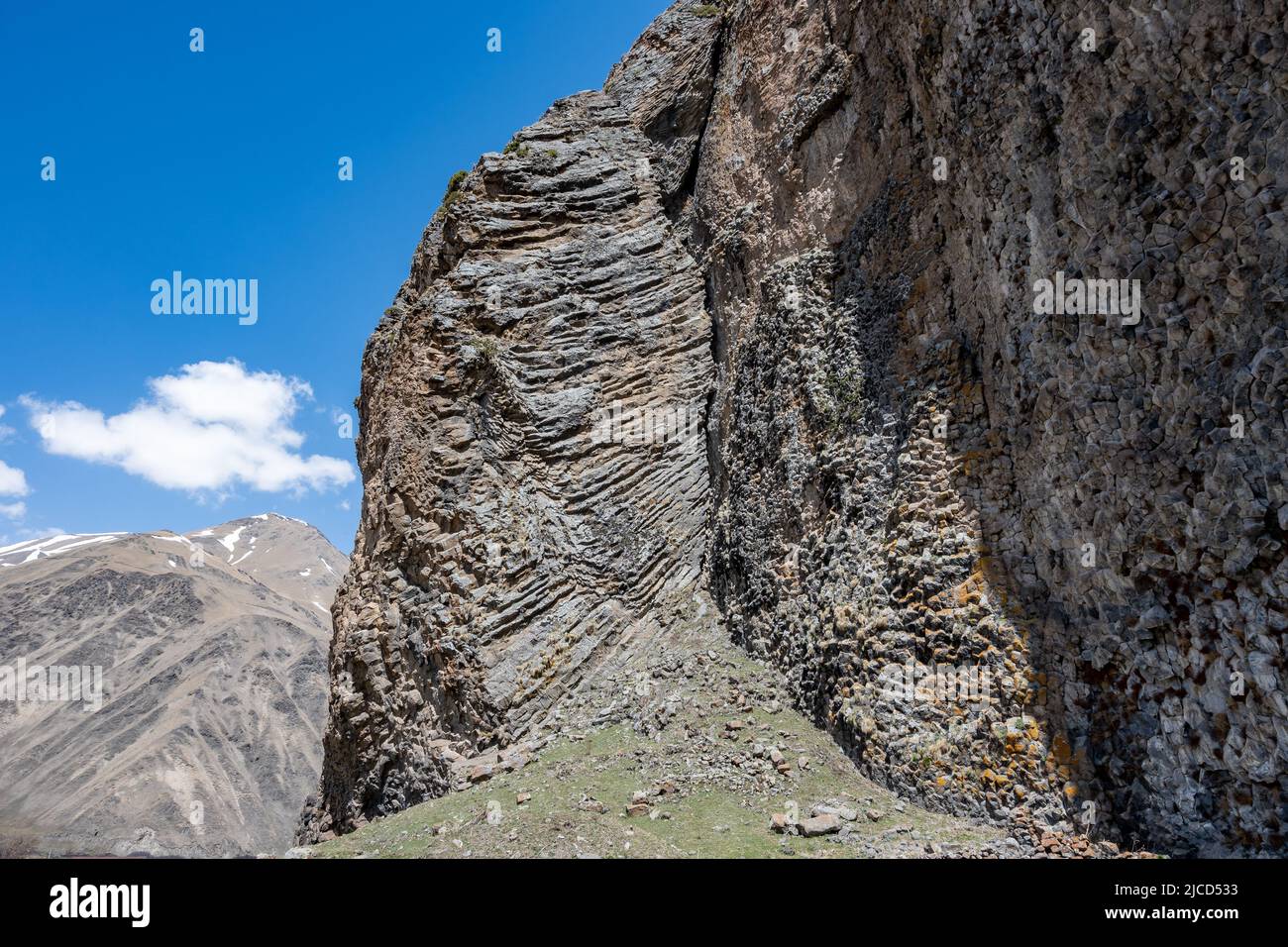 Rock outcrop with columnar joints formed after cooling of volcanic lava